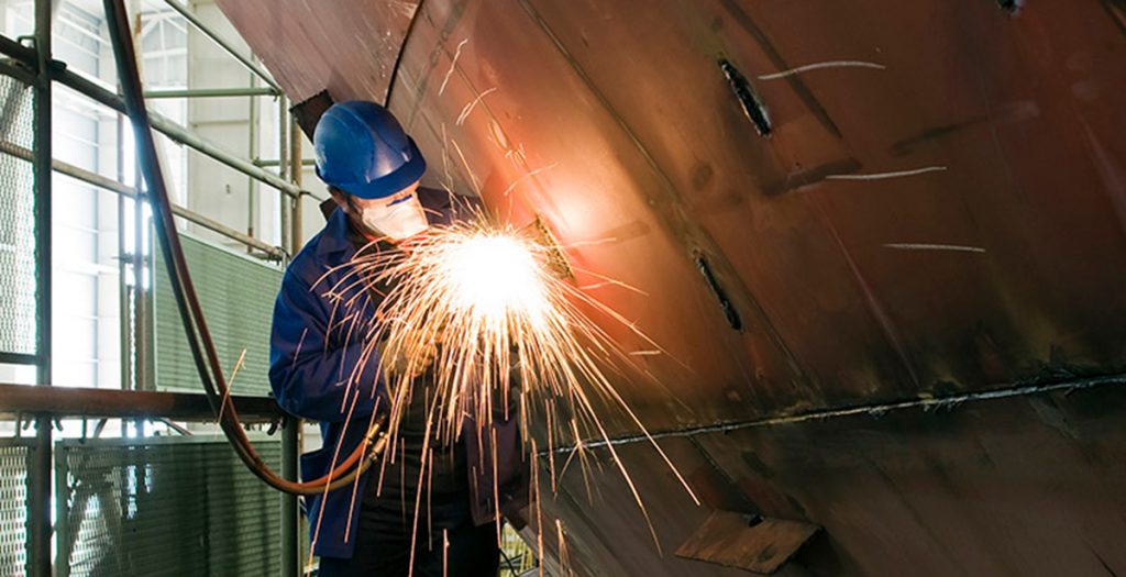 Trade worker welding metal-On Ramp